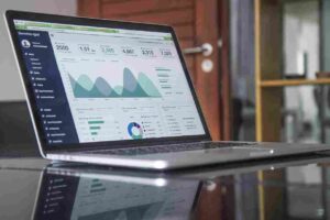 HOA financial reporting dashboard on a laptop screen